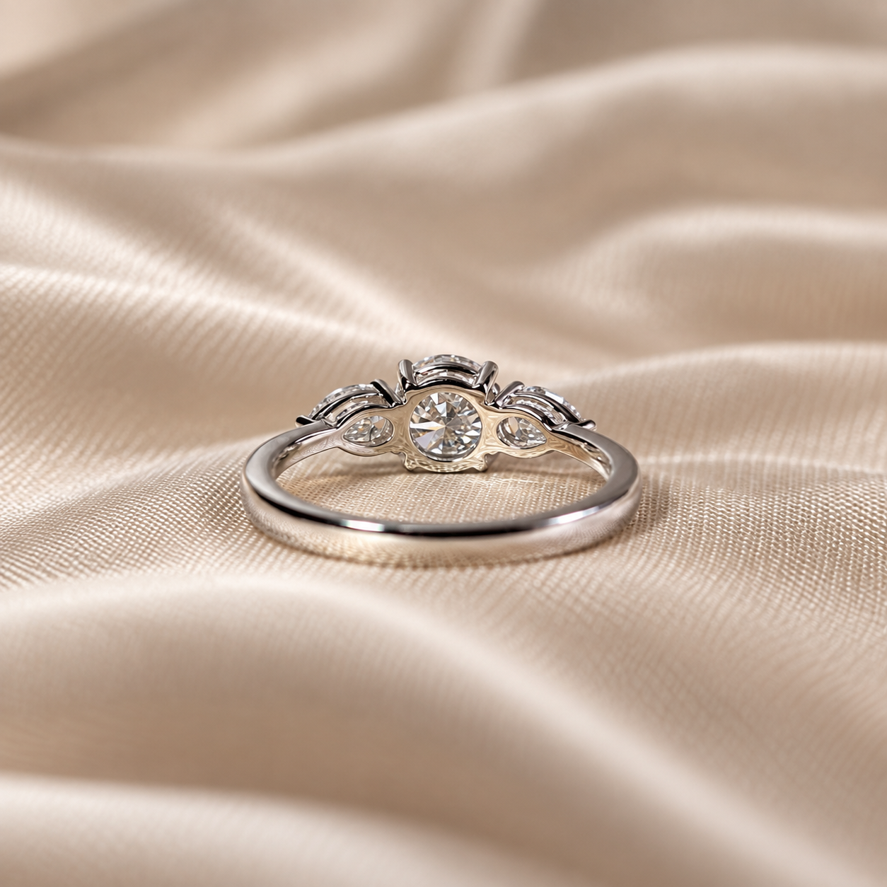 Three Stone Lab Grown Diamond Round Center with Pear Side Stone Engagement Ring
