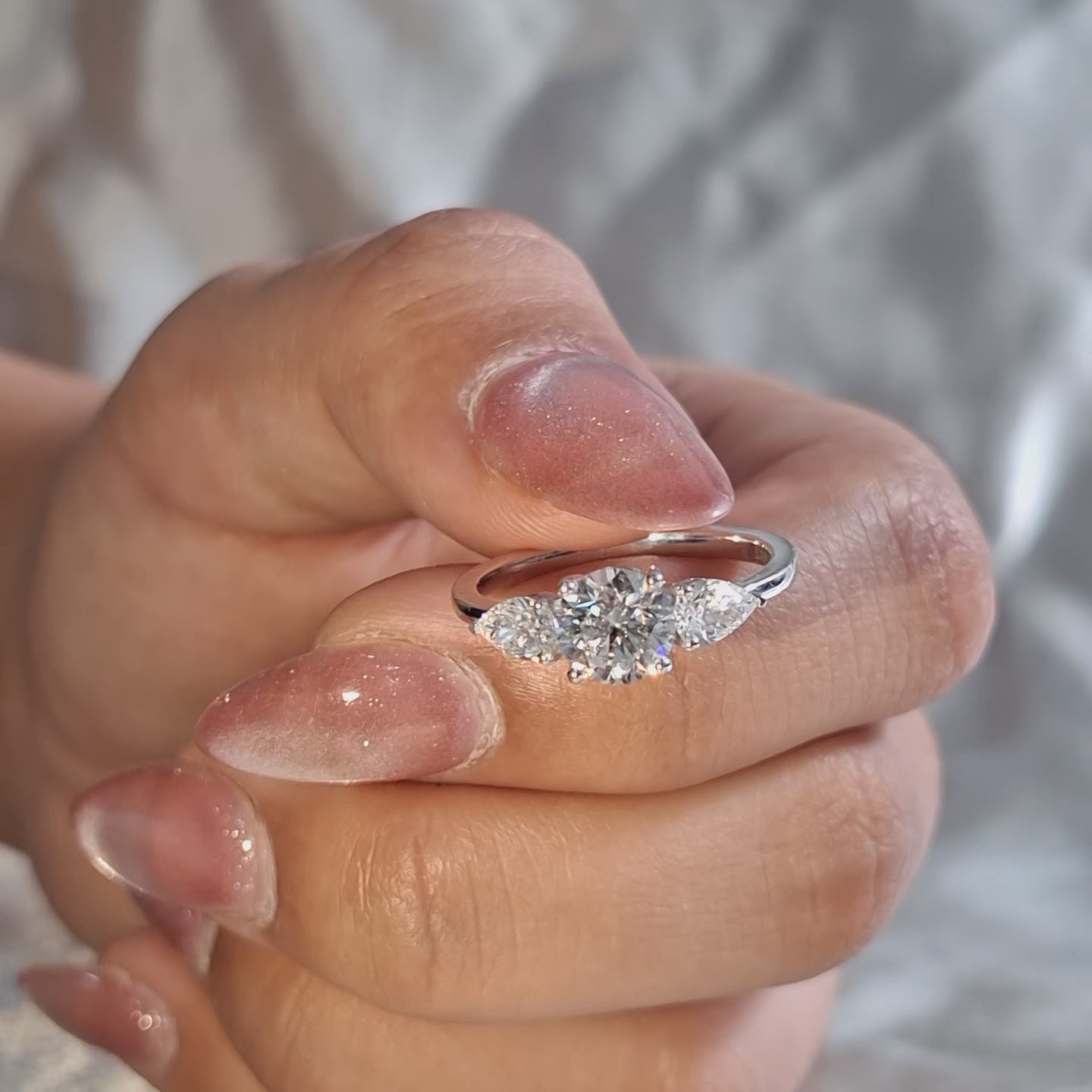 Three Stone Lab Grown Diamond Round Center with Pear Side Stone Engagement Ring